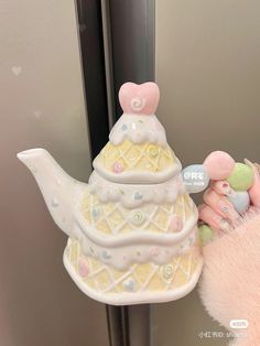 a teapot shaped like a baby's diaper