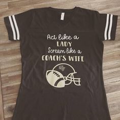 a t - shirt that says act like a lady scream like a coach's wife