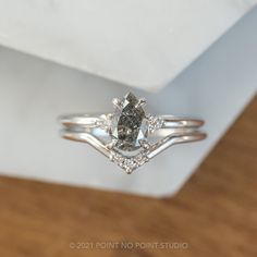 an engagement ring with three diamonds on it