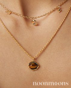 Elegance Meets Healing: Dainty Gold-Plated Tiger's Eye Charm Choker Necklace ☽ Embrace subtle sophistication with this s925 sterling silver gold-plated choker necklace, featuring a delicate tiger's eye charm stone. The charm is beautifully bezel-set and adds a touch of natural allure to the dainty charm necklace. This charm necklace pendant not only enhances your style but also serves as a healing necklace, believed to bring strength and balance. As the November birthstone, tiger's eye adds a meaningful touch, making it a perfect gift or personal keepsake. Whether you're dressing up for a special occasion or adding a chic touch to everyday wear, this charm necklace chain offers a blend of elegance and personal significance. ♥︎  DETAILS: ☽ Material: 18k Gold-plated S925 Sterling Silver, Tig Silver Gold Plated Necklace, Dainty Everyday Charm Necklaces, Luxury Minimalist Gold Plated Charm Necklace, Cheap Yellow Gold Clavicle Chain Charm Necklace, Luxury Minimalist Yellow Gold Charm Necklace, Gold Clavicle Chain Charm Necklace In Fine Jewelry Style, Gold Clavicle Chain Jewelry With Round Pendant, Gold-tone Clavicle Chain Fine Jewelry, Gold Gemstone Chain Necklace Fine Jewelry