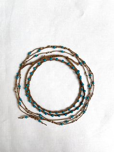 "Super-cute minimalist layered necklace - one is natural braided waxed cotton cord with turquoise faceted beads. The second necklace is long and hand-knotted with tiny, precious sterling silver beads. You have dual looks - wear the long necklace long for a dramatic effect, or doubled for a layered look. Details for both necklaces: * Handmade * Necklace lengths: 22\" and * Closure: * Style: Bohemian, beachy, summery" Adjustable Multi-strand Hand Wrapped Necklace, Adjustable Necklace For Layering, Adjustable Multi-strand Beaded Necklace For Everyday, Adjustable Hand-strung Necklaces For Layering, Handmade Adjustable Beaded Necklaces With Waxed Cord, Handmade Adjustable Beaded Necklace With Waxed Cord, Adjustable Multi-strand Bohemian Turquoise Necklace, Bohemian Multi-strand Adjustable Turquoise Necklace, Adjustable Double Strand Bohemian Turquoise Necklace