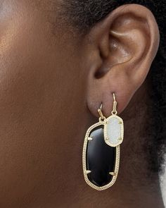 A best-selling icon designed after our signature statement shape, the Elle Gold Drop Earrings in Black Opaque Glass are inlaid with a genuine custom-cut stone. Scaled for daily wear and surprisingly lightweight, these one-of-a-kind earrings are a true collection classic. Metal 14k Yellow Gold Over Brass Material Black Opaque Glass Size 1.85"L X 0.73"W Closure Earwire Please note: Due to the one-of-a-kind nature of the medium, exact colors and patterns may vary slightly from the image shown. | Ke Wedding Rings Antique, Purple Drop Earrings, Short Pendant Necklace, Solitaire Bands, Jewelry Kendra Scott, Metallic Frame, Cat Pendant Necklace, Rings Antique, Antique Wedding Rings