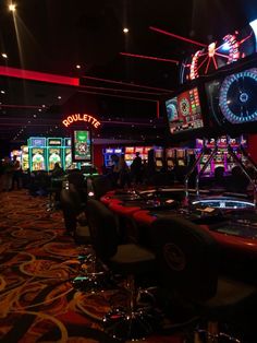 a casino room filled with lots of slot machines