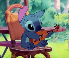 stitch is playing the guitar while sitting on a bench in disney's lili