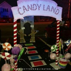 candy land entrance at night with decorations