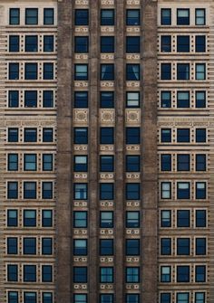 the side of a tall building with many windows