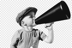 a young boy holding a black and white megaphone in his hand, while wearing a hat