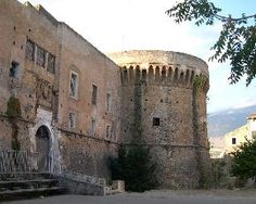 an old castle with stairs leading up to it