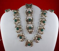 Rare vintage Mexico sterling silver ferns with malachite stones Demi parure set, Necklace, bracelet, and screw back earrings.  Unmarked as to the maker, resembles works by some of the well known artists of its time necklace is short, 14 inches overall but this one could easily be made longer with round links added weight of the necklace is 50 grams, each element is 1-1/8" long by 1 inch tall bezel set green jadeite stones in all the pieces the linear length of the bracelet is 7-1/2" long, it wou Antique Green Jewelry With Polished Finish, Vintage Hallmarked Emerald Jewelry, Green Sterling Silver Art Deco Jewelry, Adjustable Green Jewelry With Polished Finish, Silver Emerald Bracelet Jewelry, Adjustable Green Polished Jewelry, Silver Engraved Art Deco Jewelry, Collectible Hallmarked Green Jewelry, Art Deco Engraved Silver Jewelry