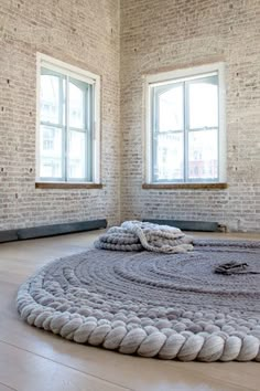 an image of a room with a rug on the floor