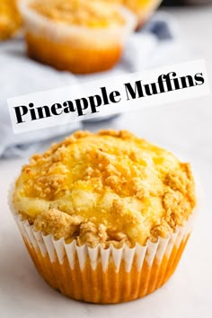 a close up of a muffin on a table with the words pineapple muffins above it