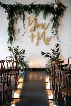 wedding decorations, flowers and candles are arranged on the wall in front of each other