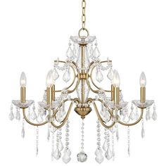 a gold chandelier with crystal drops hanging from it's center and sides