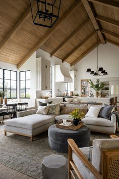 a living room filled with furniture and lots of windows