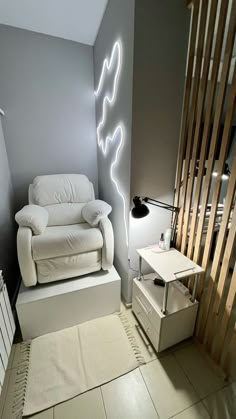 a living room with a white couch and wooden slats