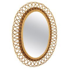 a round mirror made out of wicker