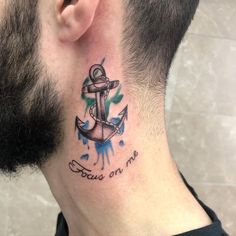 a man with a tattoo on his neck has an anchor and watercolor splashs