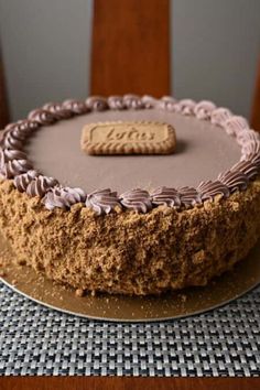 a chocolate cake with a cookie on top