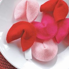 three red and pink hearts on a white plate