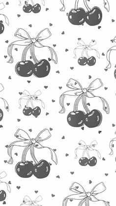 black and white cherries with bows on them are drawn in the shape of hearts