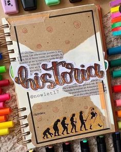 an open notebook with the word instagram written on it, surrounded by crayons and markers