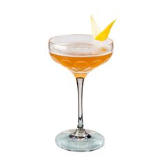 an orange cocktail in a coupe glass on a white background