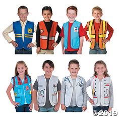 four children wearing vests and smiling at the camera