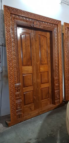 two large wooden doors sitting next to each other