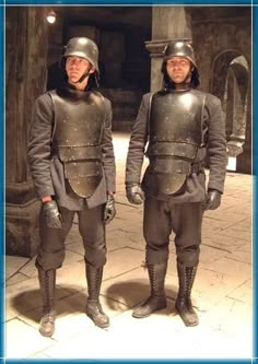 two men in armor standing next to each other