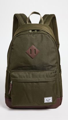 Find HERSCHEL SUPPLY CO. Herschel Heritage Backpack on Editorialist. The Herschel Supply Co. Heritage Backpack is crafted from ballistic weave with a signature logo patch at the front. It features a padded laptop sleeve, leather base and accents, side patch pockets, and a front zip pocket with a mesh pouch and interior key clip. The backpack has adjustable shoulder straps, a textile lining and a zip closure. It measures 17.75 inches in height, 12.25 inches in length, and 5 inches in depth. Soft Autumn Deep, Autumn Deep, Chicory Coffee, Mesh Pouch, Backpack Free, Flamboyant Natural, Heritage Backpack