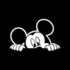 mickey mouse laying down on the ground with his eyes closed and tongue out, black background