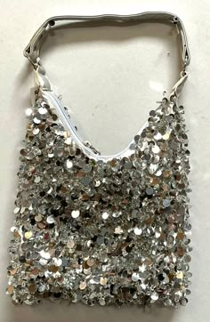 This cool and funky purse is perfect for pairing up with a cute dress! Trendy Shoulder Bag For Spring Party, Trendy Spring Party Shoulder Bag, Chic Summer Bags For Night Out, Chic Summer Night Out Bags, Trendy Summer Fashion Bags, Chic Summer Fashion Accessory Bag, Trendy Silver Summer Bags, Trendy Party Bags With Sequins, Spring Casual Party Shoulder Bag