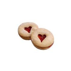 two heart shaped cookies sitting on top of each other