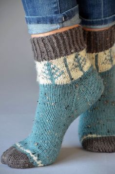 a woman's legs wearing blue and brown socks