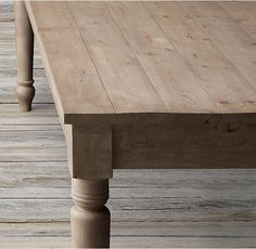 a wooden table sitting on top of a wooden floor