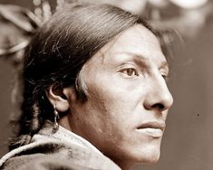 an old black and white photo of a native american man