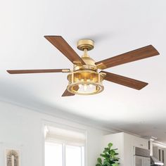 a living room with a ceiling fan and white walls