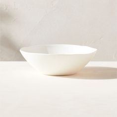 a white bowl sitting on top of a table