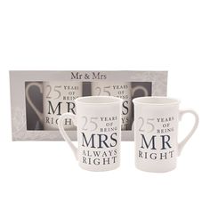 two mugs with the words mr and mrs printed on them in front of a box