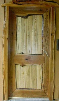 an open wooden door in the corner of a room