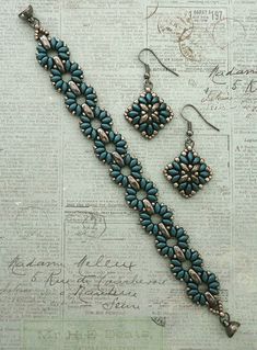 a pair of blue beaded bracelet and earrings on top of a piece of paper