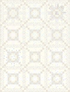 a white quilt with many squares and dots on it