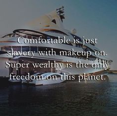 a large white boat in the water with a quote on it saying comfortable is just slivery with make up on super healthy is the only freedom on this planet