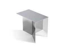 a small silver table sitting on top of a white floor