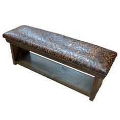 a wooden bench with a leather seat on it