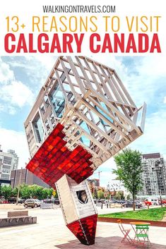 a red and white sculpture with the words 13 reason to visit calgary canada on it