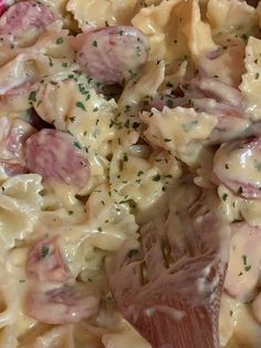 a close up view of some pasta with meat and cheese on it in a bowl