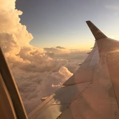 the wing of an airplane as it flies through the clouds