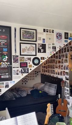 a room filled with lots of pictures and guitars