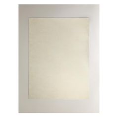 an empty white square is hanging on the wall in front of a plain white background